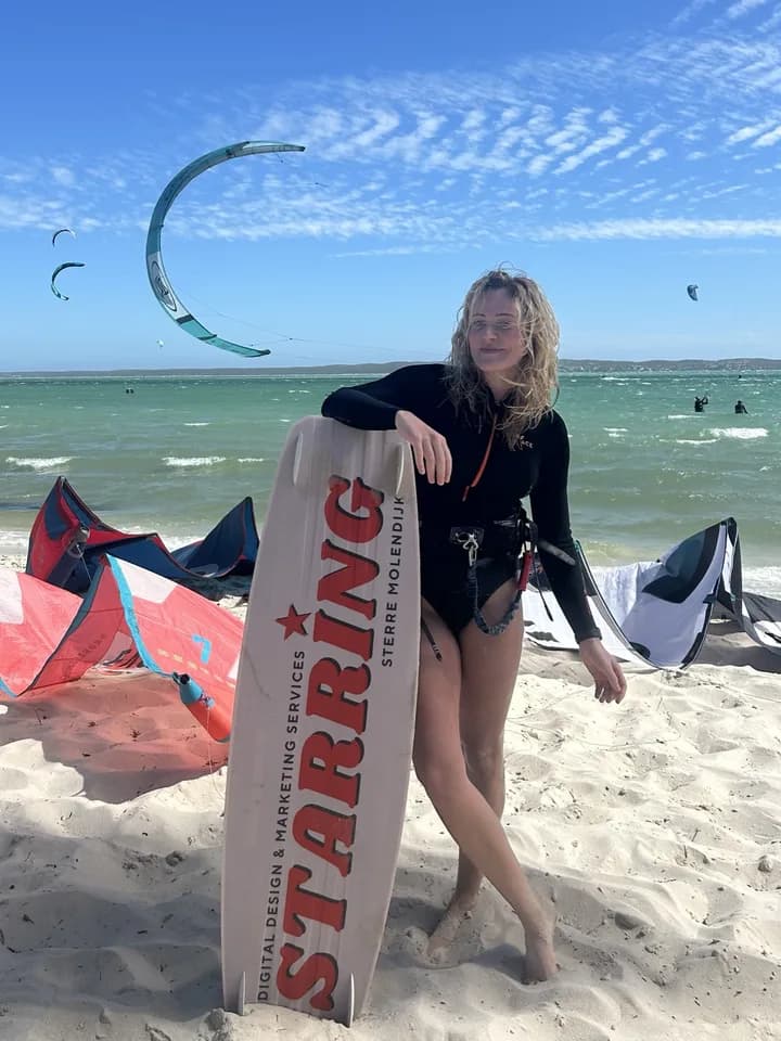 Sterre with a Starring kiteboard on the beach