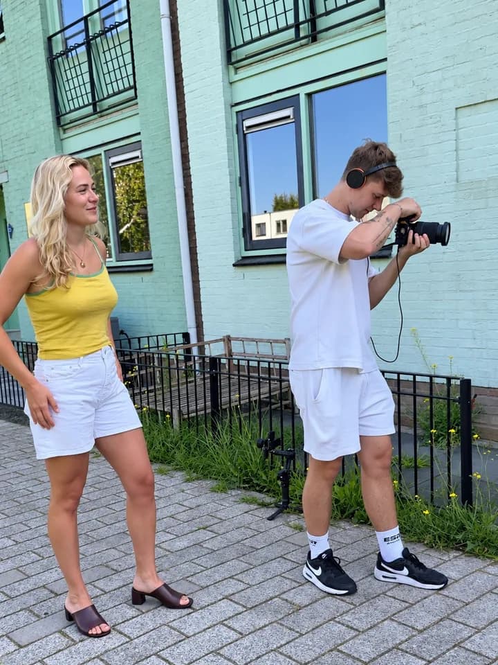 Sterre at a video shoot with a camera operator