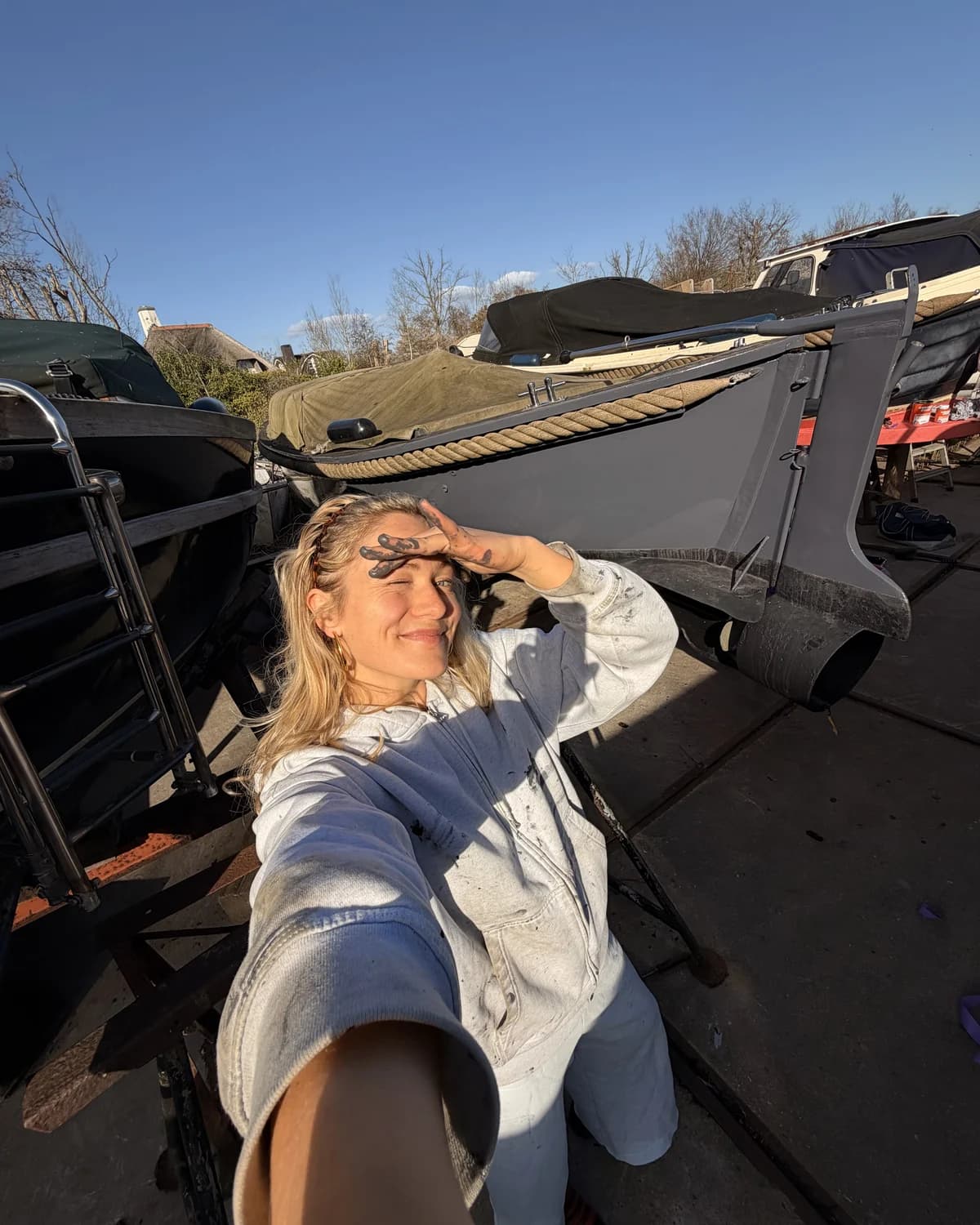 Sterre on the quay, restoring her boat